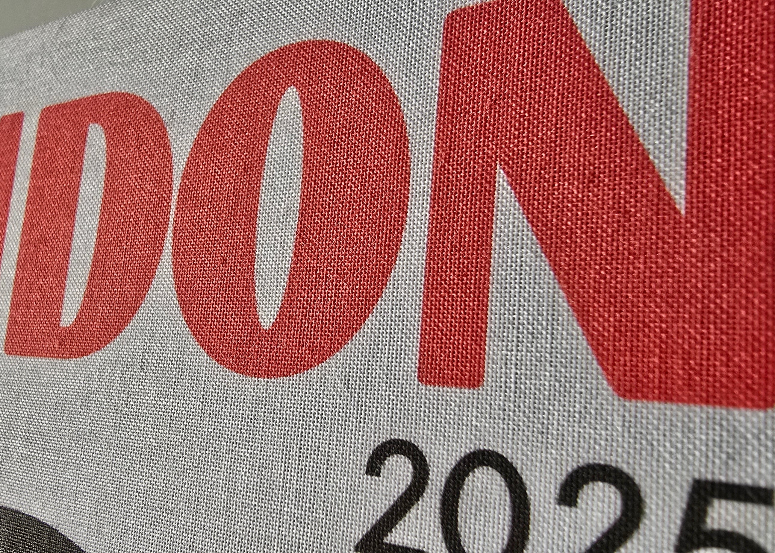 Text 'LONDON 2025' on a fabric background
