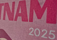 Text 'VIETNAM 2025' on a textured surface with a dark border.