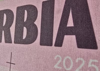 Text 'SERBIA 2025' printed on a fabric background
