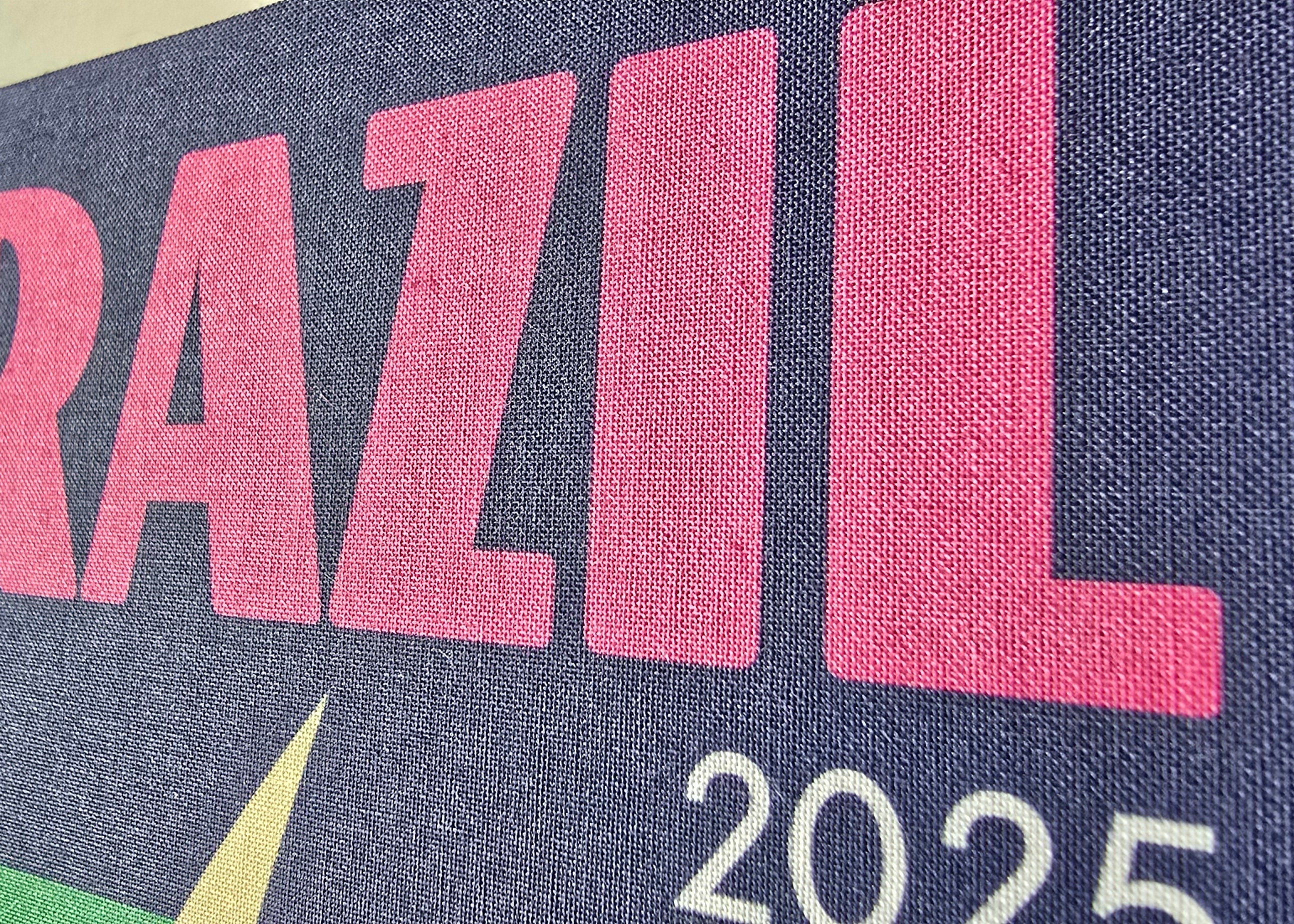 Text 'BRAZIL 2025' on a blue background with pink letters.