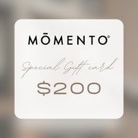 Momento $200 gift card on a blurred background