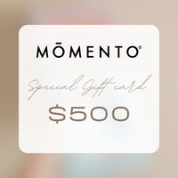 Momento Special Gift Card worth $500 on a blurred background