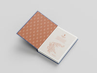 Open book with a patterned cover on a light gray background