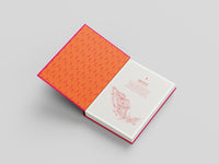 Open book with textured orange cover on a light gray background