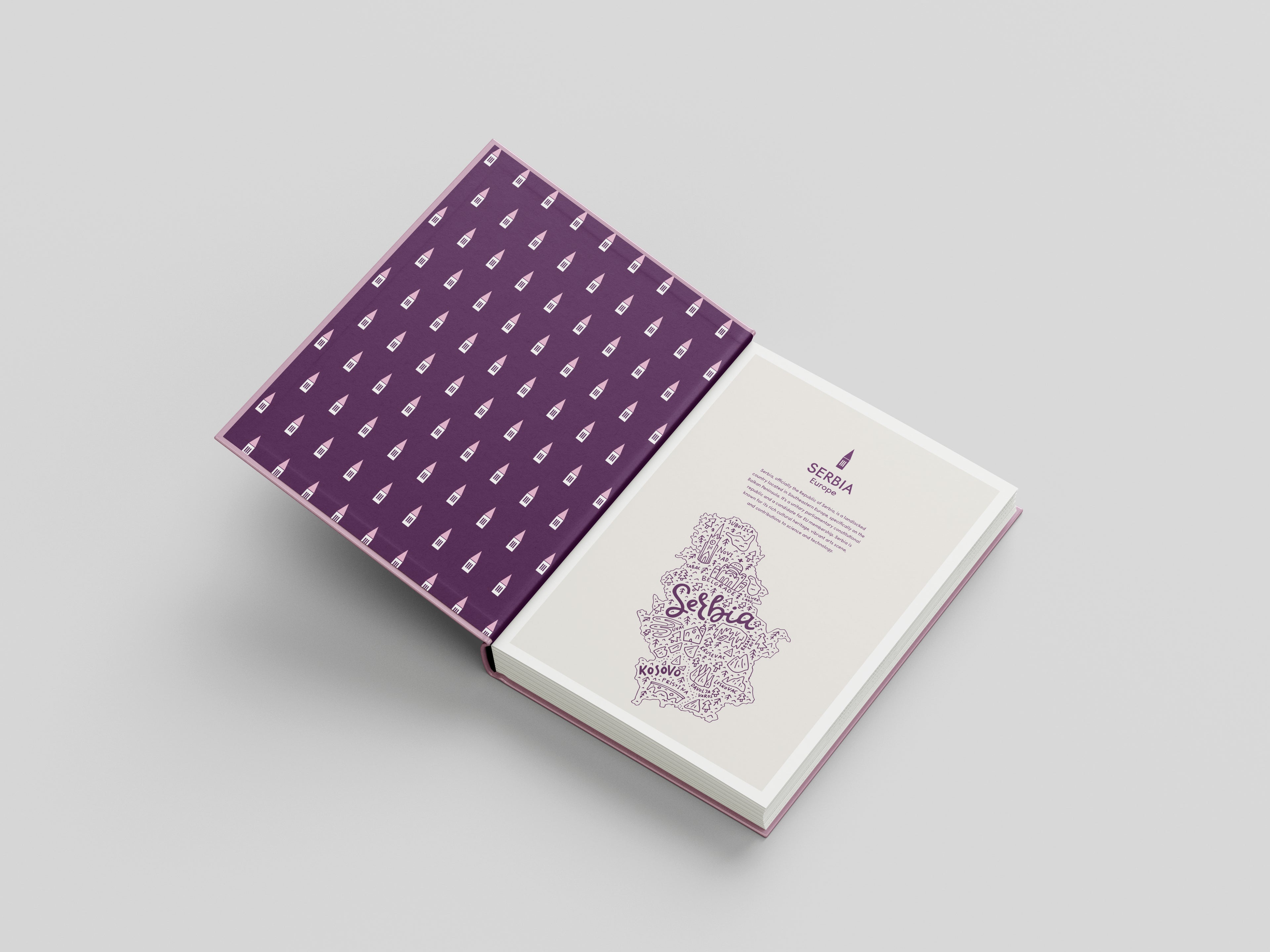 Open book with purple patterned cover on a light gray background