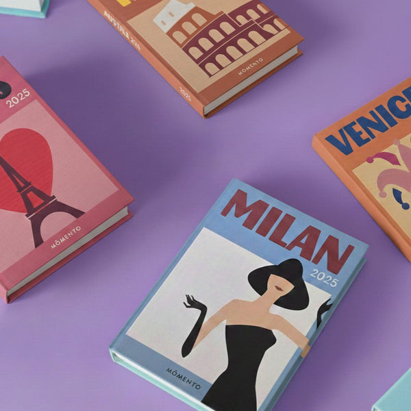 Collection of travel-themed books on a purple background