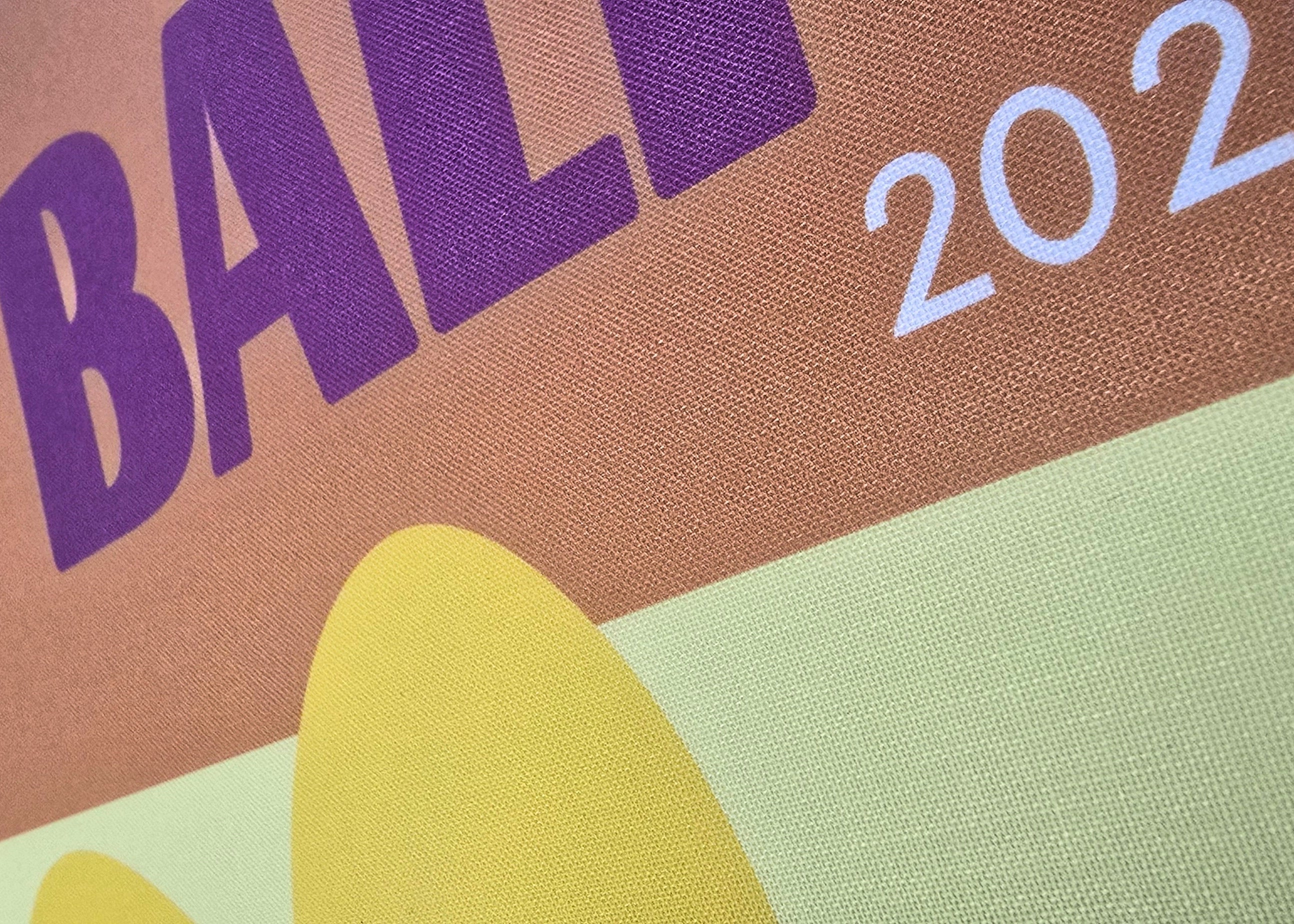 Colorful poster with 'Bali 2025' text on a brown background