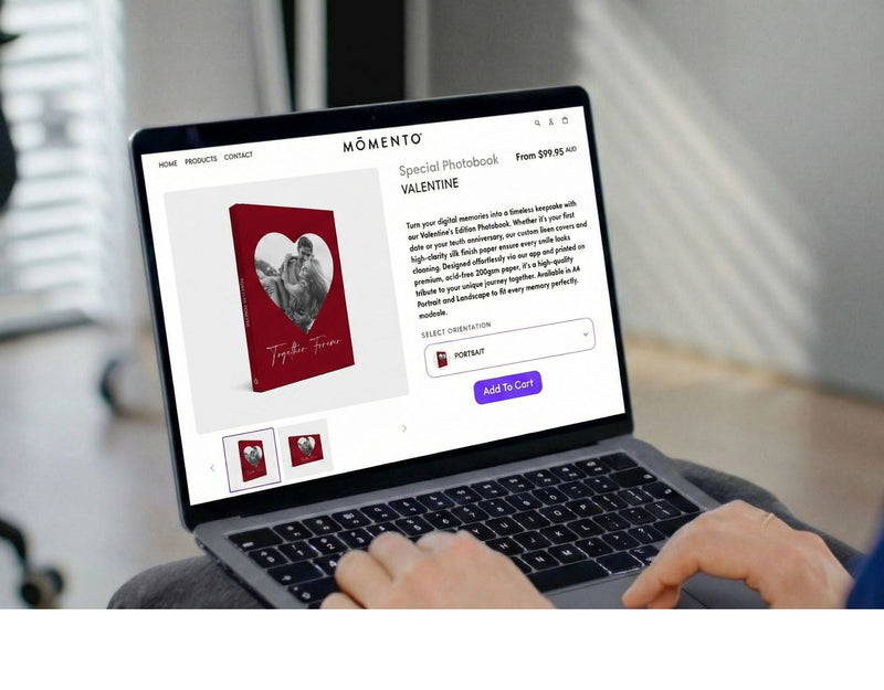 Person using a laptop on a couch with a website open on the screen