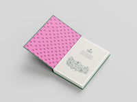 Book with pink patterned cover and white back cover on a gray background